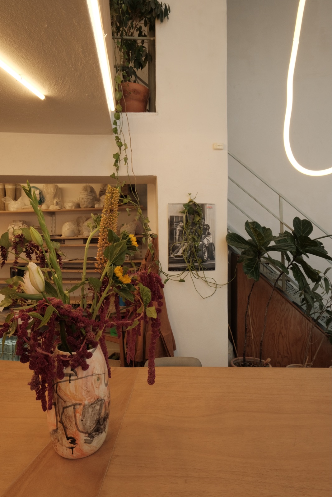 Vase with amaranth on the shared table