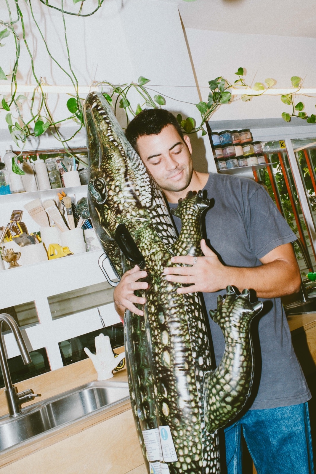 Alexandros Ntouras holding a ceramic crocodile