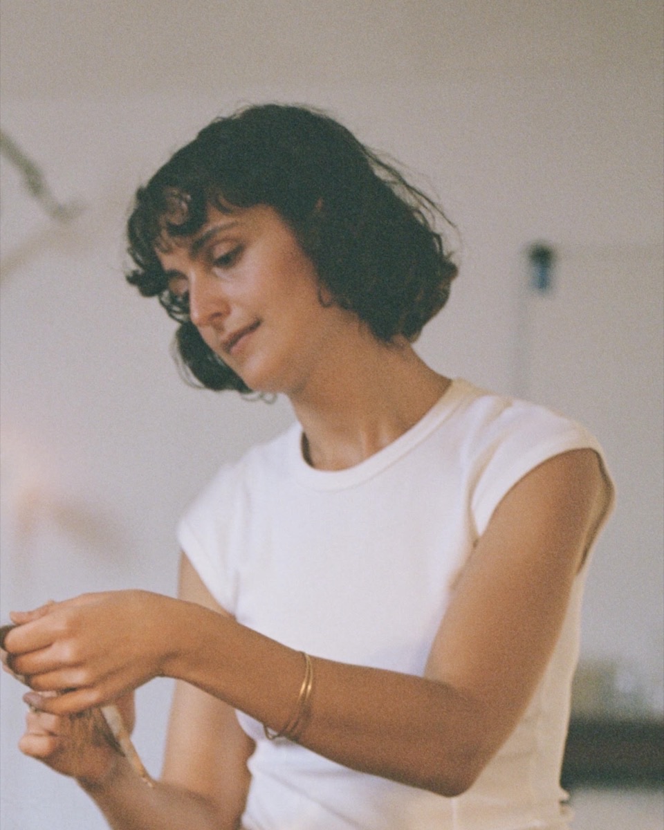 Ariadni Strofylla with a brush in the studio